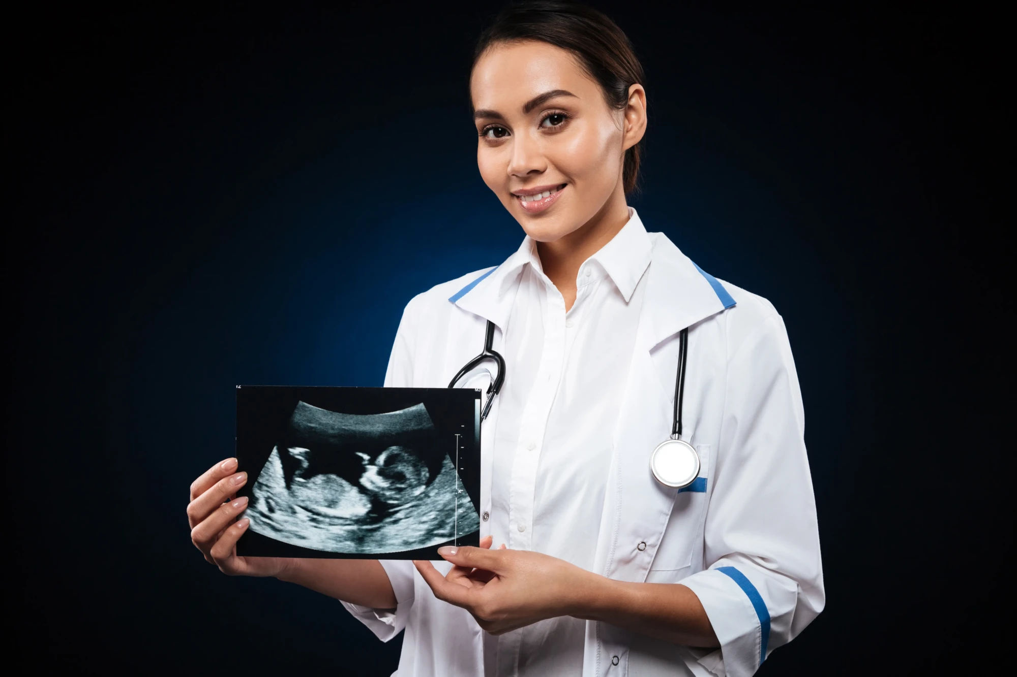 young-cheerful-doctor-holding-ultrasound-scan-baby